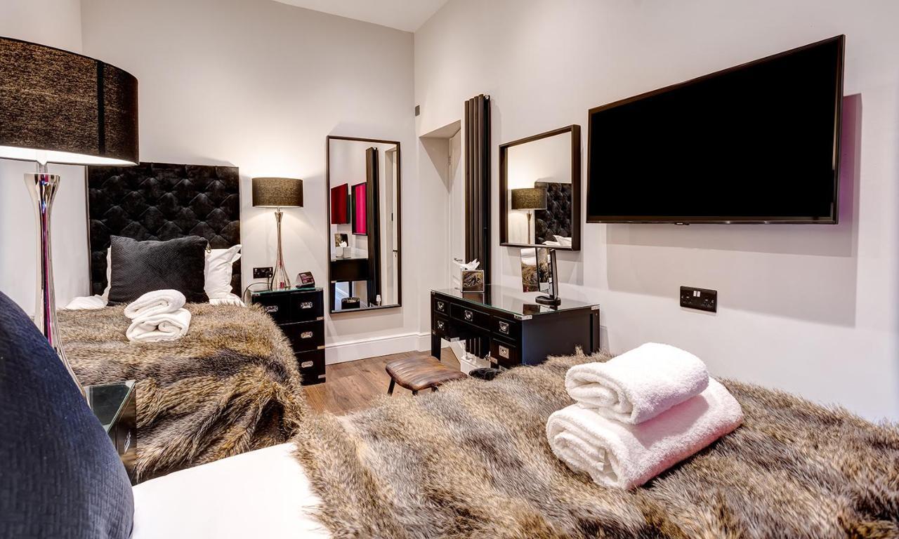 Kotel Windermere Extérieur photo A bedroom at The Ivy Collection