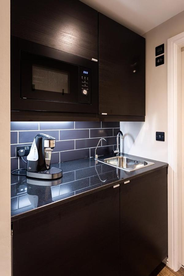 Kotel Windermere Extérieur photo A Nespresso coffee machine in a kitchen